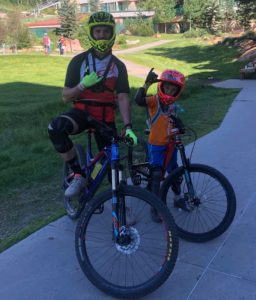 Woody and Liam on their bikes at Purgatory Bike Park.