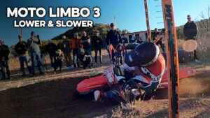 Cole Reynolds under the limbo bar on his Honda CR250F.