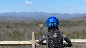 Kris Vermillion's son looking at the view while riding his mountain bike.