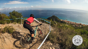 Porsha Murdock racing mountain bikes on the cliffs of Italy.