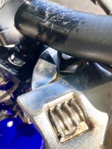 Open crescent wrench on fork preload nut.