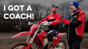 Dirt bike rider and coach talking sag setting