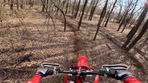 GasGas being ridden in the single track