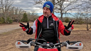 Dirt bike coach showing proper finger position for levers.