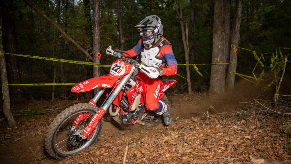 Dirt bike racer attacking the trail during an enduro race.