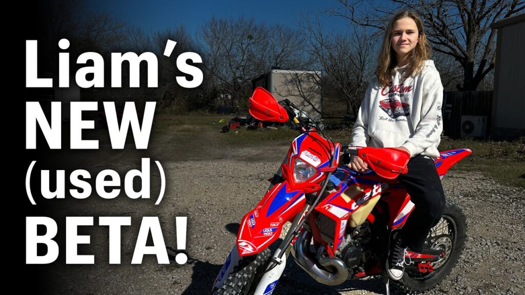 Dirt bike rider sitting on their new used dirt bike.