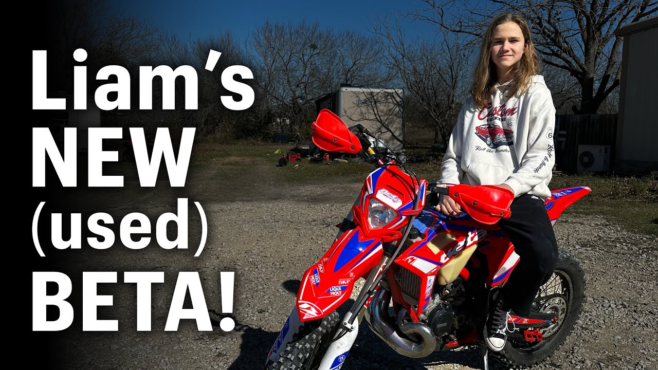 Dirt bike rider sitting on their new used dirt bike.
