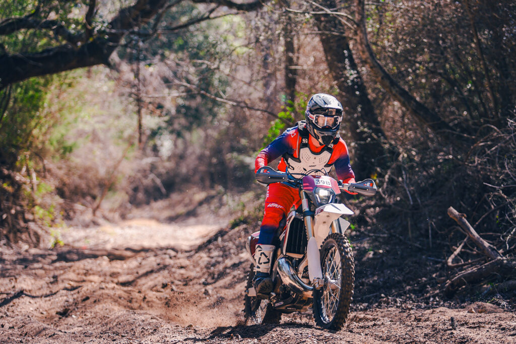 Fantic XE300 two stroke tackling deep sand wash in Texas enduro