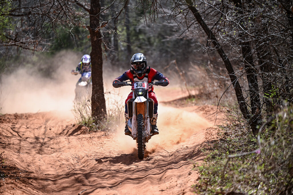 Fantic enduro racer being chased down by another racer.