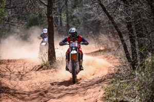 Fantic enduro racer being chased down by another racer.