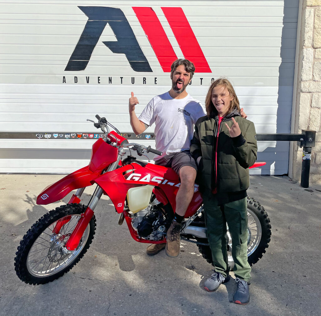 Dirt bikers excited to pick up their new dirt bike.